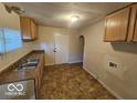 Functional kitchen with ample counter space and storage, ready for your culinary creations at 3209 Bethel Ave, Indianapolis, IN 46203
