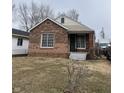 Charming brick home with a cozy front porch and well-maintained landscaping at 3451 Brouse Ave, Indianapolis, IN 46218