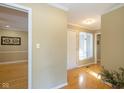 Bright foyer with hardwood floors, neutral walls, and access to multiple rooms in the home at 3636 Woodglen Way, Anderson, IN 46011