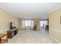Spacious living room with plush carpeting, a large window, and comfortable furnishings at 3636 Woodglen Way, Anderson, IN 46011