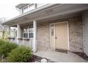 Inviting front porch with brick facade, decorative columns, and a cozy seating area at 436 N Shore Ct, Franklin, IN 46131