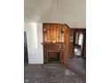 Living room fireplace with wood paneled walls and lighting at 439 N Colorado Ave, Indianapolis, IN 46201