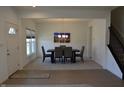Open concept dining room featuring elegant lighting and room for six at 5303 Rum Cherry Way, Indianapolis, IN 46237
