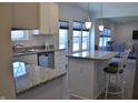 Bright kitchen featuring stainless steel appliances, granite countertops, tiled floor and white cabinets at 5303 Rum Cherry Way, Indianapolis, IN 46237