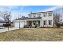 Charming two-story home features a brick facade, attached garage, and front porch with swing at 803 Hickory Way, Noblesville, IN 46062