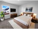 Well-lit main bedroom with a plush rug, modern furniture, and a picturesque window view at 8310 Bearberry Ln, Pendleton, IN 46064