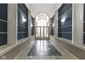 Bright lobby with a window at the end of the hallway and sconce lighting at 8751 Jaffa Court E Dr # 17, Indianapolis, IN 46260