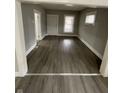 Bright living room with gray floors, offering a modern and inviting space at 1207 N Kealing Ave, Indianapolis, IN 46201
