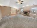 Open living room showcasing a fireplace and large windows that provide an abundance of natural light at 12840 Patrick Ct, Fishers, IN 46038