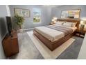 Cozy bedroom featuring modern decor, a comfortable bed, and warm lighting for a relaxing atmosphere at 12840 Patrick Ct, Fishers, IN 46038