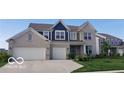 Beautiful two-story home with a brick facade, two-car garage, and well-manicured lawn at 1347 Preserve Ct, Greenwood, IN 46143