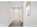 Clean entryway with tiled floor, neutral paint, and a welcoming front door at 14344 Cuppola Dr, Noblesville, IN 46060