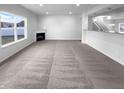 Spacious open-plan living room with a large window and modern design at 15138 Silver Charm Dr, Noblesville, IN 46060