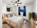 Cozy bedroom with a comfortable bed, soft blue accents, and a bright window view at 17 Crestview Dr, Greenwood, IN 46143