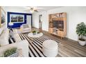 Bright living room with modern furnishings and a stylish black and white rug at 17 Crestview Dr, Greenwood, IN 46143