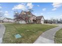 Two story home with a well maintained lawn and nearby sidewalk at 17879 Sandy Run Ct, Noblesville, IN 46062