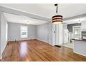 Spacious living room featuring hardwood floors, ample natural light, and neutral paint, an inviting space at 3011 S 550 W, Columbus, IN 47201