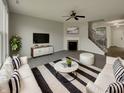 Stylishly furnished living room with hardwood floors, fireplace, and contemporary décor at 5371 Hibiscus Dr, Plainfield, IN 46168