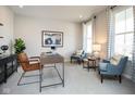 Bright office space featuring two comfy chairs, natural light, and serene decor at 7348 Deerberg Dr, Indianapolis, IN 46259