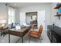 Well-lit office space boasting a modern desk, comfortable seating, and ample natural light at 7348 Deerberg Dr, Indianapolis, IN 46259