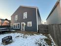 View of the house with a fenced backyard, showing the home's back door at 9613 W Stargazer Dr, Pendleton, IN 46064