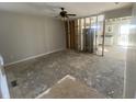 Spacious living room ready for renovation, featuring an open layout concept to the kitchen at 12151 Bearsdale Dr, Indianapolis, IN 46235