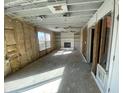 Spacious living room with a fireplace and shelves ready for renovation at 12151 Bearsdale Dr, Indianapolis, IN 46235