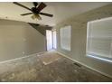 Bright living room ready for renovation, featuring large windows for natural light at 12151 Bearsdale Dr, Indianapolis, IN 46235