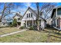 Quaint home with a cozy front porch, mature trees, and inviting curb appeal in a quiet neighborhood at 139 S Ritter Ave, Indianapolis, IN 46219