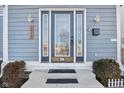 Inviting front door design with decorative glass, side lights, and stylish exterior lighting at 1413 S East St, Indianapolis, IN 46225