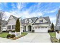 Attractive two-story house with a well-manicured lawn and a two-car garage at 15745 Market Center Dr, Carmel, IN 46033