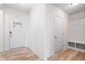 Bright foyer with luxury vinyl plank flooring, coat closet and a view to the front door at 16401 Brigham Ln, Westfield, IN 46074