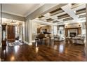 Open concept floor plan showcasing the formal living room, dining room, and beautiful hardwood floors at 2235 Shaftesbury Rd, Carmel, IN 46032