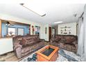 Cozy living room featuring hardwood floors, comfortable seating, and lots of light at 22569 State Road 37 N, Noblesville, IN 46060