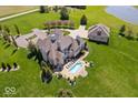 Sprawling estate featuring a backyard swimming pool, guest house, and well-manicured grounds at 2766 S Honey Creek S Rd, Greenwood, IN 46143