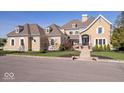 Stunning home featuring lush landscaping, elegant stonework, and a grand entrance at 2766 S Honey Creek S Rd, Greenwood, IN 46143