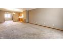 Spacious living room features a large window, neutral paint, and plush carpeting at 304 E 48Th St, Anderson, IN 46013