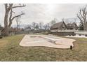 Large backyard with pool, detached garage, and privacy fencing at 37 N Main St, Indianapolis, IN 46227