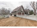 Spacious backyard deck with white picket fence, perfect for outdoor entertaining at 37 N Main St, Indianapolis, IN 46227