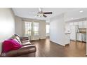 Comfortable living room with hardwood floors, a ceiling fan, and natural light at 459 Dekalb Dr, Westfield, IN 46074