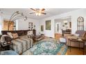 Inviting living room with hardwood floors, ample seating, and natural light, perfect for Gathering gatherings at 6225 Indianola Ave, Indianapolis, IN 46220
