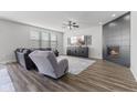 Stylish living room featuring a sleek fireplace, plush seating, and a large TV at 6922 Kara Ln, Brownsburg, IN 46112