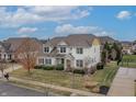 Aerial view of a well-manicured suburban home with a spacious front yard and inviting curb appeal at 10264 Normandy Way, Fishers, IN 46040