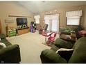 Spacious living room with vaulted ceiling, comfortable seating, and lots of natural light at 1195 Hinson Rd, Martinsville, IN 46151