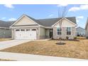 Charming single-story home with stone accents, attached garage, landscaping, and a blue sky at 1230 Maumee Ct, Greenfield, IN 46140