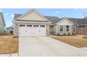 Charming single-story home with stone accents, attached garage, driveway, and lawn at 1230 Maumee Ct, Greenfield, IN 46140