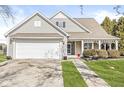 Well-maintained home with a two-car garage, inviting entrance, and lush green lawn at 1338 Valdosta Pl, Westfield, IN 46074