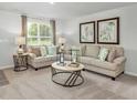 Cozy living room featuring neutral tones, plush seating, and abundant natural light at 13820 N Fairwood Dr, Camby, IN 46113