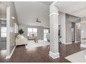 Open concept living area with modern furniture, an area rug, ceiling fan, and plenty of natural light at 17215 Meggs St, Westfield, IN 46062