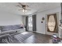 Living room features natural light from window and modern gray accents at 250 Three Notch Ln, Bargersville, IN 46106